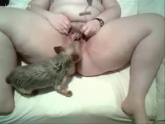 She lets her pet dog lick her wet pussy